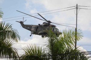 A Malaysian army helicopter flies in Cenderawasih near the area where the stand-off with Filipino gunmen and Malaysian security forces was taking place in Tanduo village on Tuesday. Malaysian security forces launched an assault on supporters of the Sultanate of Sulu engaged in a three-week incursion that has left 27 people dead.